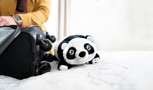 Panda Snuggle Glove Travel Pillow for Kids on Bed
